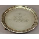 A MID 20TH CENTURY INDIAN COLONIAL WHITE METAL SALVER of circular form with moulded edge, engraved