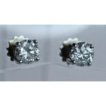 A PAIR OF 18CT WHITE GOLD AND DIAMOND SOLITAIRE EARRINGS the brilliant-cut diamonds measuring 1ct