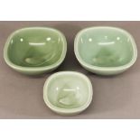 A GROUP OF THREE ROYAL COPENHAGEN PORCELAIN BOWLS  two large and one smaller, by Nils Thorsson, of