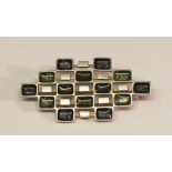 A DAVID ANDERSON 925S AND ENAMEL BROOCH of open geometric form with green and grey enamelling,