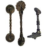 THREE COPPER-ALLOY PASTRY JIGGERS comprising an early 19th-century example with wheel, knopped