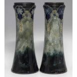 Pair of Royal Doulton stoneware vases,   moulded with flowers and scrolls, 31cm high Condition