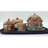 Pottery Thatched cottage, 3-piece teaset and a "Shakespeare" half timbered 3-piece condiment set