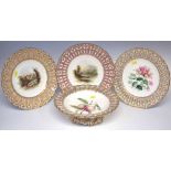 Three English porcelain cabinet plates and a comport probably Minton, painted with landscapes, fruit