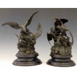 Pair of patinated bronze groups of two eagles preying on an ibex, after the model by Christophe