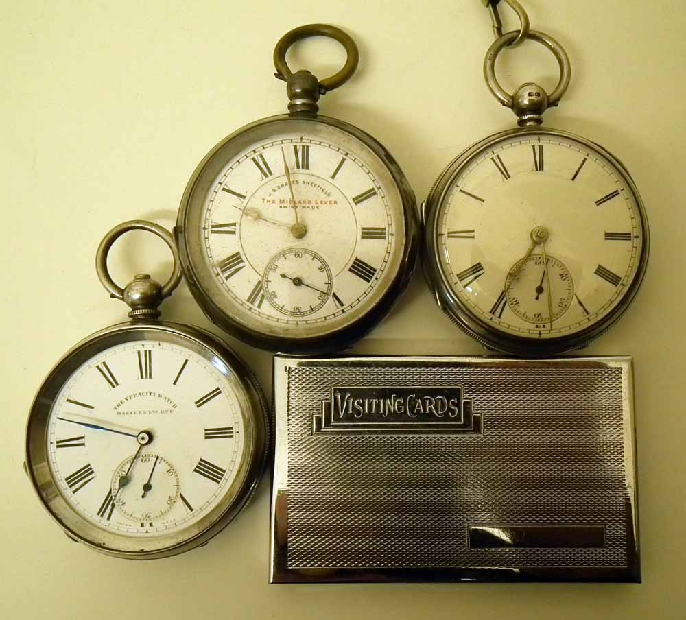 Three Silver cased open faced pocket watches and a chrome card case Condition report: see terms