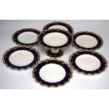 Royal Crown Derby part dessert set comprising of six plates and a comport with jewelled navy blue