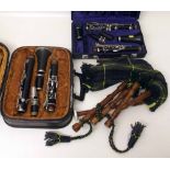 Two cased clarinets one by La Fleur, the other unmarked, also a set of bagpipes (Junior size).