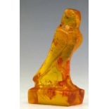 Reconstituted amber model of a falcon, height 9cm.