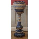 Doulton Lambeth jardinière and pedestal  applied with moulded decoration, impressed mark to base