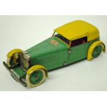 A Meccano No.1 touring car constructor set, in green and yellow, two-seat closed sedan body,