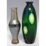 Two art glass vases   one probably Loetz, the other of opalescent green glass, 30cm high