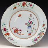 Chinese famille rose large plate, painted with a vase of flowers, gourd and a butterfly, within a