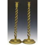 Pair of brass helical candlesticks, height 51cm.