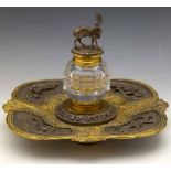 Parcel gilt and silvered inkstand, late 19th century, the rounded square base with a central glass