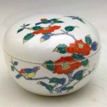 Japanese Nabeshima compressed globular box and cover painted with flowering foliage, diameter 10cm.