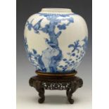 Kangxi style blue and white ginger jar painted with foliage, height 17cm, together with a hardwood