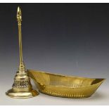 Brass door porter weighted with lead, height 34cm and a seamed brass bread dish (2).