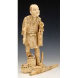 Japanese ivory sectional okimono of a fisherman with a basket of terrapins, a lantern and a shoulder