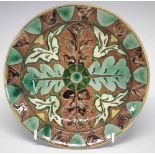 Della Robbia plate, incised with stylised leaves,   painted by Annie Jones, incised and painted