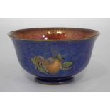Wedgwood lustre bowl  decorated with fruit within mottled blue and orange grounds, printed mark to