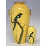 Two Cauldon vases signed D. Birbeck,   painted with magpies on a yellow ground, printed marks to