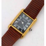 Cartier gold plated wristwatch, the rectangular black Roman dial in a rectangular case, width