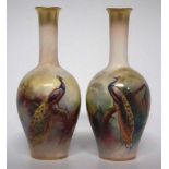 Pair of Royal Worcester vases   decorated with peacocks, one with indistinct signature (probably J.
