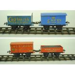 Hornby Series O gauge, four various freight wagons: Carr's Biscuits; Cadbury's Chocolates;