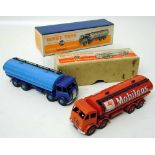 Two Dinky Foden tankers No. 504, one in Mobilgas red coachwork, the other two-tone blue, both boxed.
