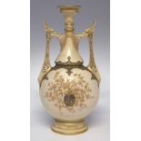 Royal Worcester Persian style twin handled vase  decorated with raised paste gilded leaf work, shape