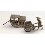 China Trades model of a junk, 8.5cm; another model of a coolie and barrow, 6cm (2)