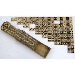 Bone double-nine set of dominoes in a bone box with a pegboard sliding cover, 18th or 19th