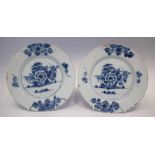 Pair of Delft plates circa 1750   painted with flora and rockwork in underglaze blue, 23cm diameter