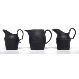 Three Black Basalt jugs circa 1800   one impressed Birch the other two attributed to Birch with