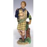 Derby figure of a Scotsman circa 1800   modelled standing, incised model number 378 to base, 27cm