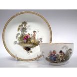 Meissen cup and saucer circa 1780   painted with children in gardens, blue crossed swords and star
