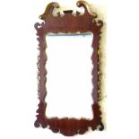 George II style mahogany and gilt wood pier glass, the shaped plate in a fretwork frame with a break