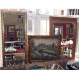 Two mirrors and a painting of a village scene. Condition report: see terms and conditions