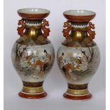 Pair of Japanese Kutani porcelain baluster vases painted in iron red and gilt with a continuous