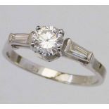 Single stone diamond ring, brilliant cut, 0.73ct, on baguette shoulders, in 18K white shank, ring