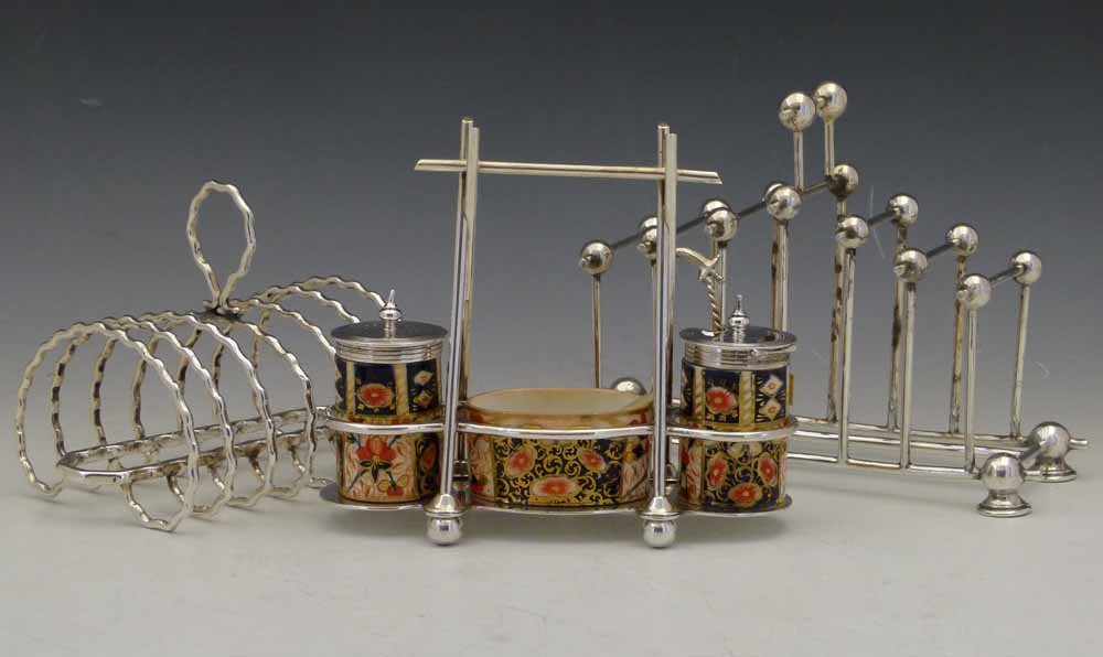 Daniel & Arter EPNS toast rack in the style of Christopher Dresser, No. G8020, length 19.5cm; a