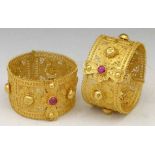 Pair of Indian filigree yellow metal hinged bangles composed of stylised floret panels with