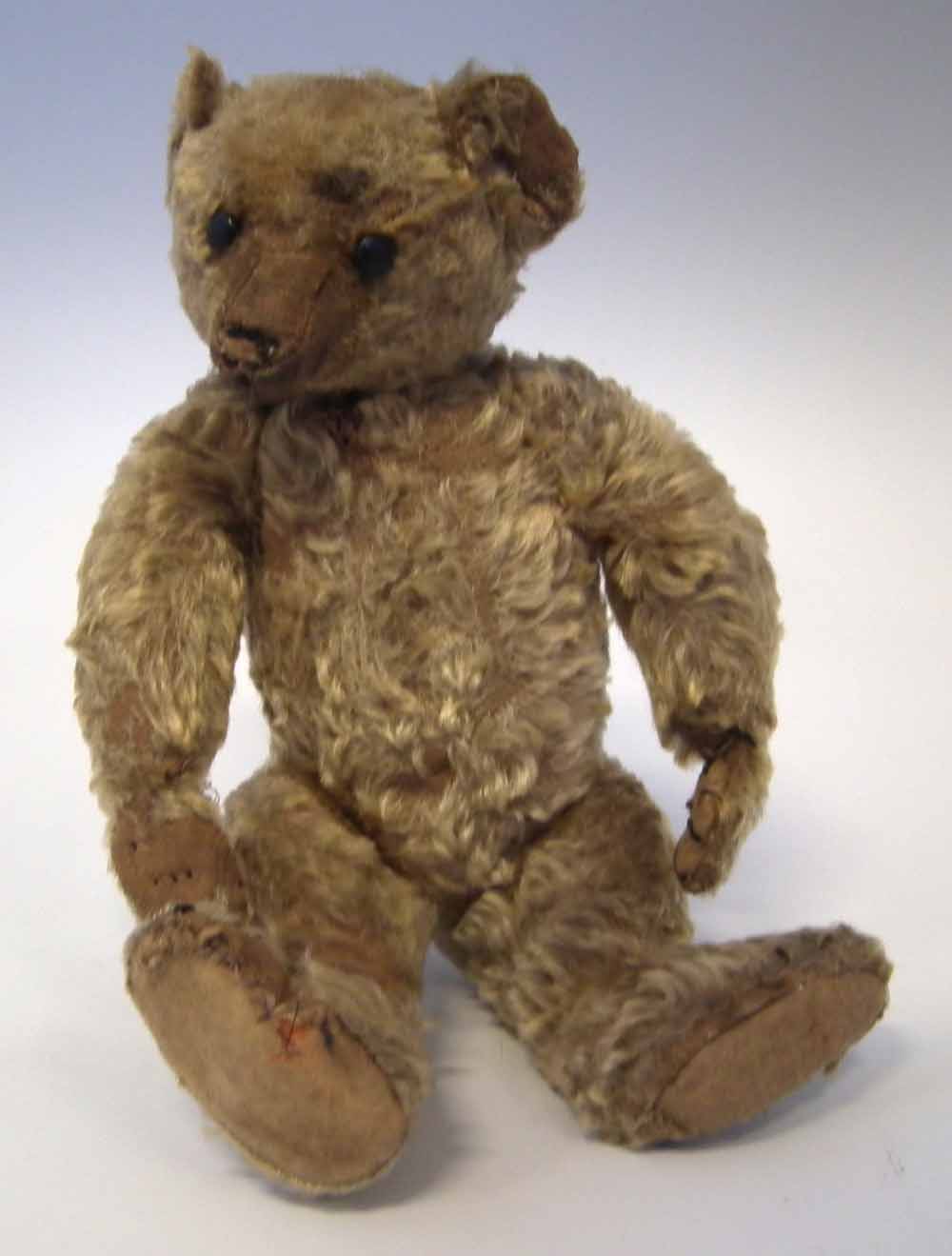 William Terry teddy bear with button eyes, jointed limbs and blond fur, early 20th century, 33cm