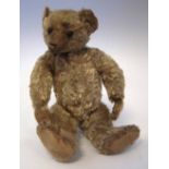 William Terry teddy bear with button eyes, jointed limbs and blond fur, early 20th century, 33cm