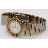 Lady's Omega Constellation quartz bracelet watch, stainless steel and gold, diamond bezel, white