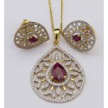 Ruby and diamond necklace and matching ear studs, in each the pear shaped coloured stone in a pear