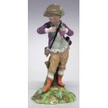 Copenhagen figure of a boy circa 1775 modelled as holding bunches of grapes, indistinct blue mark to