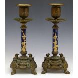 Pair of Victorian bronze and porcelain candlesticks, Rd. mark 1883, the blue ground stems painted in