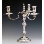 Early 18th century style cast silver candelabrum by Richard Comyns, London 1963, the hexagonal